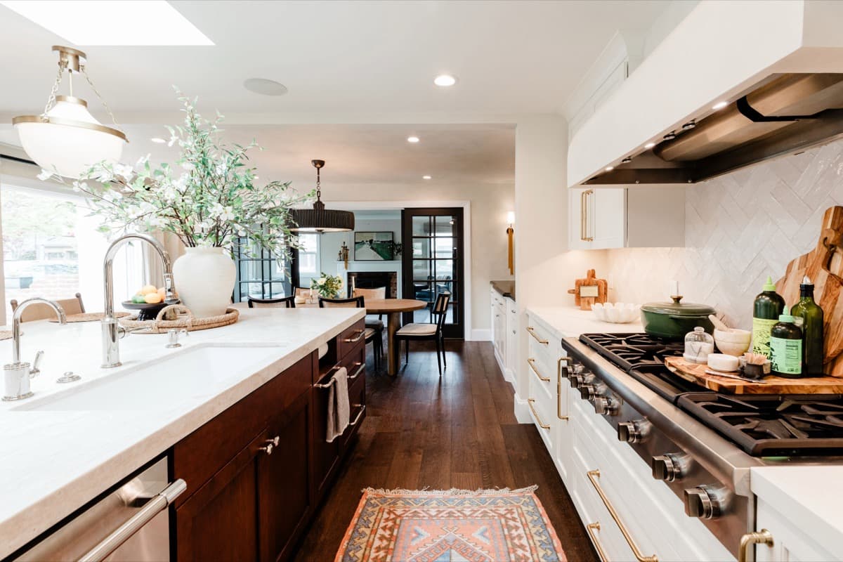 Range wall of the Morgan Hill kitchen with brass pulls