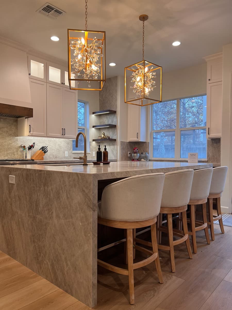 Marble waterfall edge on the stained walnut island