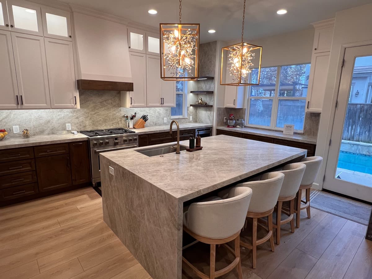 Range wall of the Gilroy kitchen with a custom walnut hood surround